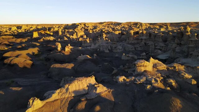 Cinematic aerial shot of Valley of Dreams in Bisti De Na Zin Wilderness in New Mexico