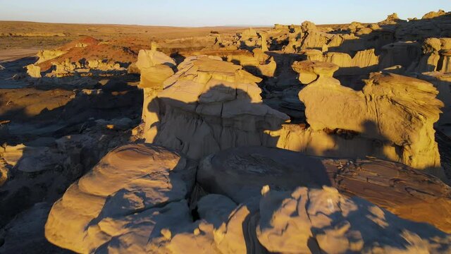 Cinematic aerial shot of Valley of Dreams in Bisti De Na Zin Wilderness in New Mexico