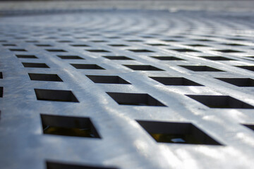 Closeup of a metallic street gutter texture