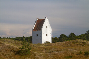 Fototapeta premium White tower in the dunes, the Sand-buried Church, Skagen, Denmark