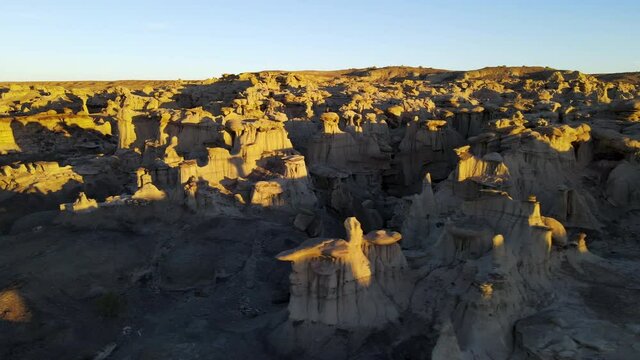 Cinematic aerial shot of Valley of Dreams in Bisti De Na Zin Wilderness in New Mexico