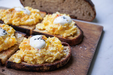 Scramble eggs on toasted whole grain bread.                                            