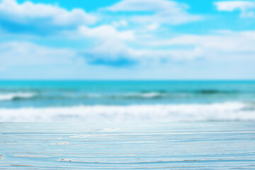 Fototapeta na wymiar blue wood table top on blur sea wave background