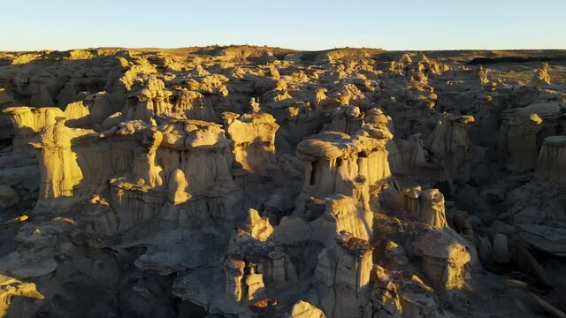 Cinematic aerial shot of Valley of Dreams in Bisti De Na Zin Wilderness in New Mexico