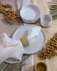 modern table setting with white ceramic tableware