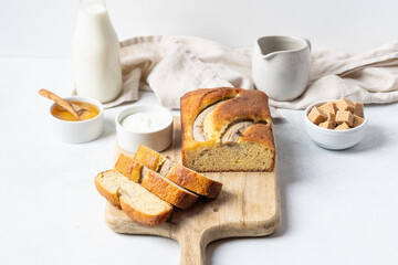 Fototapeta na wymiar Crispy banana bread with cinnamon on a gray concrete background. Dessert. 