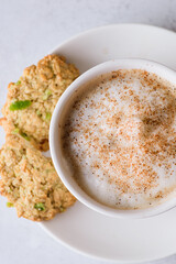 coffee in a mug with milk and cinnamon
