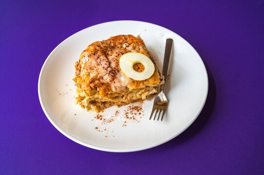 Traditional Czech republic dessert "zemlovka" with grated apple and pieces of pastry in milk.