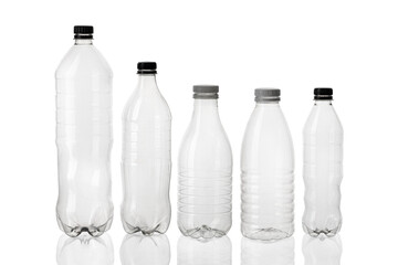 Silhouette of different types and sizes of empty transparent plastic bottles on white isolated...