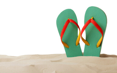 Turquoise flip flops in sand on white background