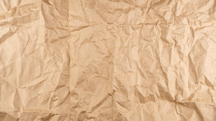 Old crumpled recycled brown paper background texture banner background