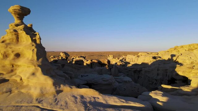 Cinematic aerial shot of Valley of Dreams in Bisti De Na Zin Wilderness in New Mexico