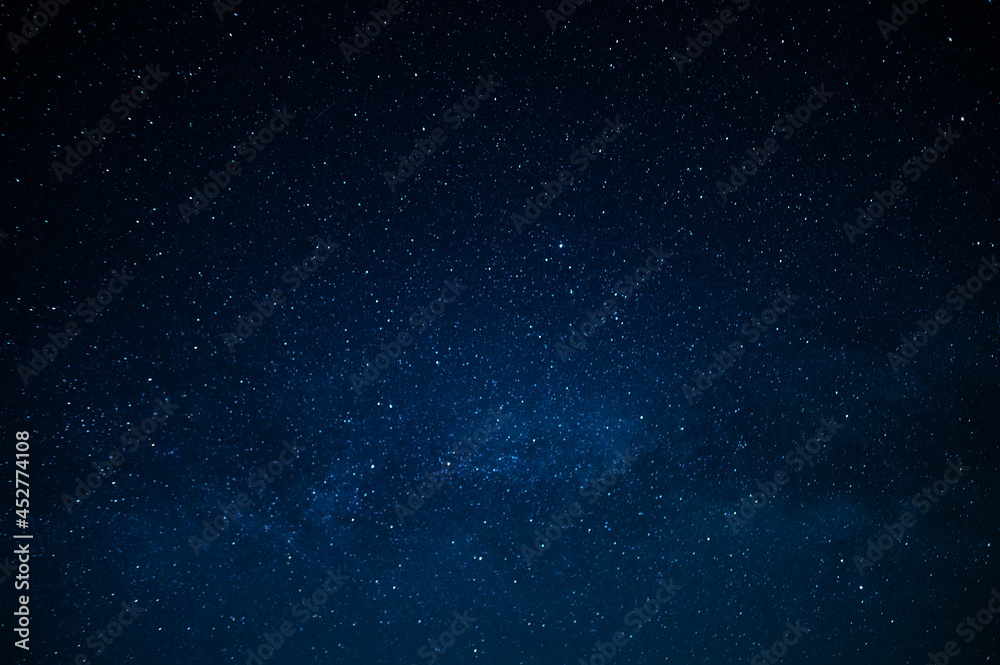 Wall mural dark blue night sky and small twinkling stars. abstraction. minimalism. there is no one in the photo