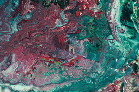 Fluid with a mixture of red and green. Modern trend fluid. Bright marble fluid.