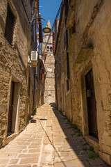 Fototapeta na wymiar A residential road in the historic medieval hill village of Buje in Istria, Croatia 