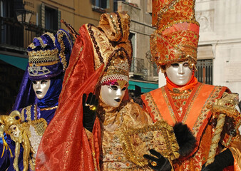 Fototapeta na wymiar Carnival goers pose for photographs at the Venice Carnival