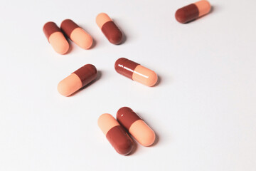 Close-up medical capsules on a white background. Soft focus