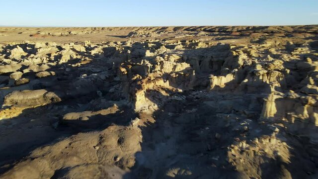 Cinematic aerial shot of Valley of Dreams in Bisti De Na Zin Wilderness in New Mexico
