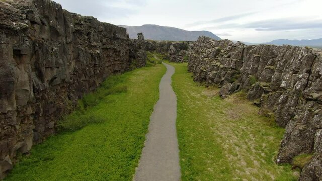Footpath between tectonic plates in Thingvellir National Park in Iceland
