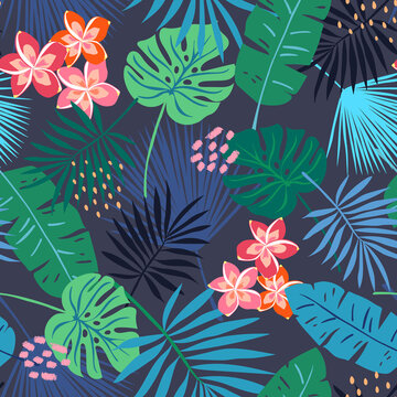 All over tropical seamless vector repeat pattern with leaves and frangipani flowers in dark navy blue colors with bright accents. Good for beach, coastal and other projects