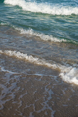 Sea or ocean tropical landscape view. Sea waves under the sun. Summer vacation and travel concept. Water wave surface. Sand beach. 