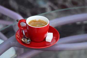 Red cup of coffee outdoors