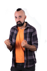 Energetic young man looking at camera and holding his fists