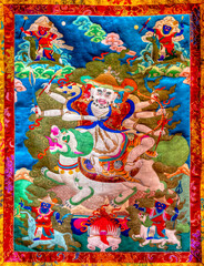 Bunte Gebetsteppiche mit buddhistischen Motiven