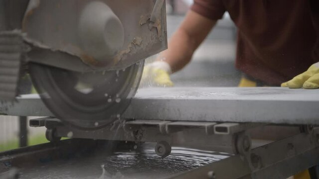 Concrete Outdoor Path Tile Cutting and Preparing For Paving