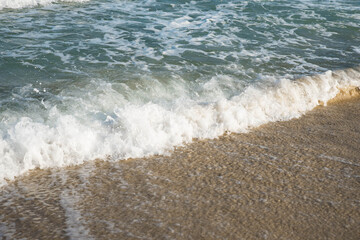 Sea or ocean tropical landscape view. Sea waves under the sun. Summer vacation and travel concept. Water wave surface. Sand beach. 