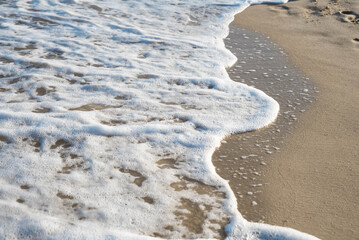 Sea or ocean tropical landscape view. Sea waves under the sun. Summer vacation and travel concept. Water wave surface. Sand beach. 