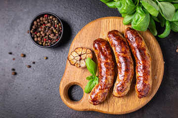 fried sausages fresh pork, beef or lamb fresh portion ready to eat meal snack on the table copy...