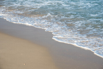 Sea or ocean tropical landscape view. Sea waves under the sun. Summer vacation and travel concept. Water wave surface. Sand beach. 