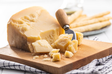 Pieces of italian parmesan cheese. Block of parmesan