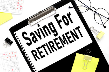 Saving For Retirement, text in notepad next to glasses on white background