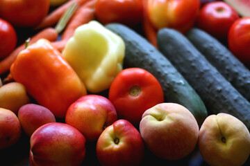 Various colorful summer fruit and vegetable on dark background. Selective focus.