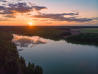 Fototapeta na wymiar Magical sunset over lake in Belarus. Drone aerial photo
