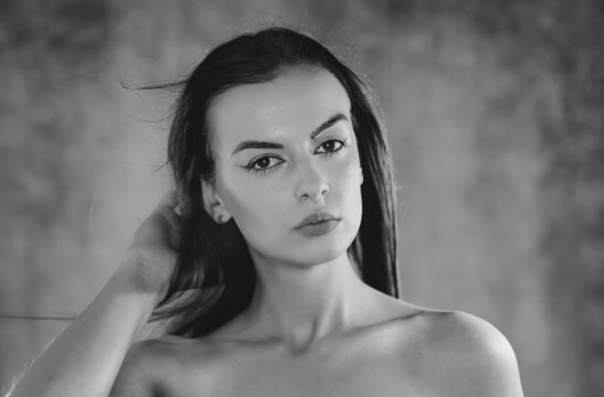 Portrait shot of a pretty young woman. Black and white photography