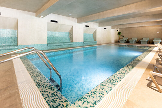 Indoor swimming pool in hotel wellness center