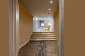 Interior of a hotel corridor with marble stairs