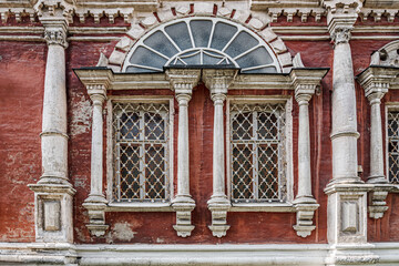 Fototapeta na wymiar windows of an old Russian Orthodox church of the 18th century in baroque style, Vvedensky temple in Barashi, Moscow, Russia