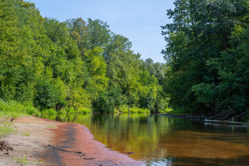 Beautiful summer landscape of the Small Cheremshan river with forest, banks, grass and current. The Ulyanovsk.