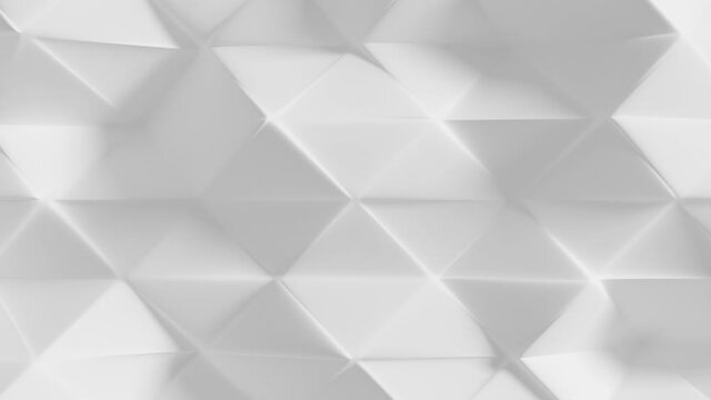 Beautiful Geometric Surface Loop 1 White: elegant animation of a smooth beveled triangular polygon mesh in white. Clean easy polished background. Minimal abstract white 3D animation.  
