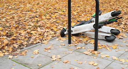 overturned electric scooters, end of season, fall