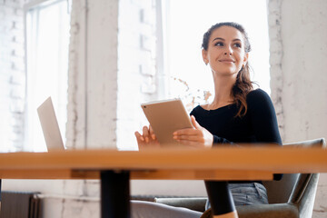 A smart entrepreneur corresponds with a client by e-mail. A freelance woman runs a blog on a social network on a gadget. A student is studying online in a college class