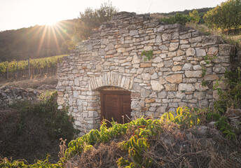 Nice old stone vine cellar in Csopak Region in Hungary in the afternoon lights