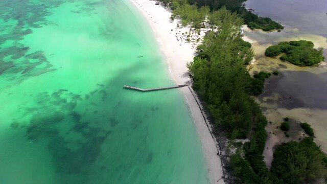 Aerial Panning Idyllic View Of Isla De La Pasion Island, Drone Flying Over Turquoise Sea On Sunny Day - Cozumel, Mexico