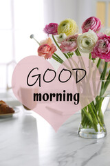 Beautiful fresh ranunculus flowers on table in kitchen. Good morning