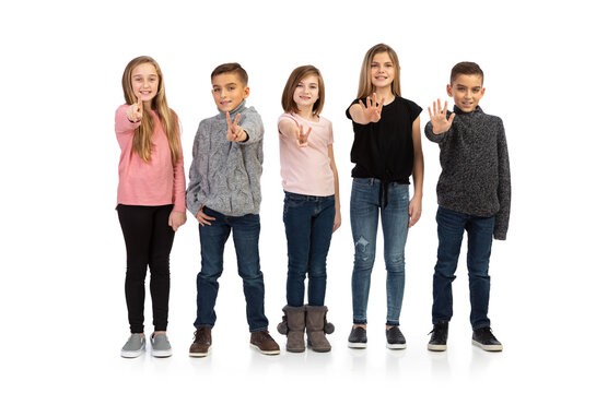 Kids: Group Of Children Point At Camera