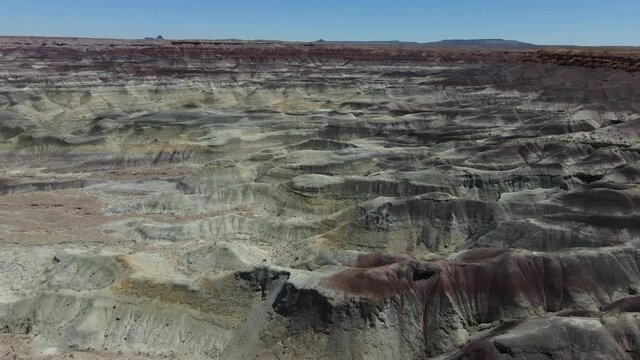 Cinematic aerial shot of colorful strata of Painted Desert in Arizona